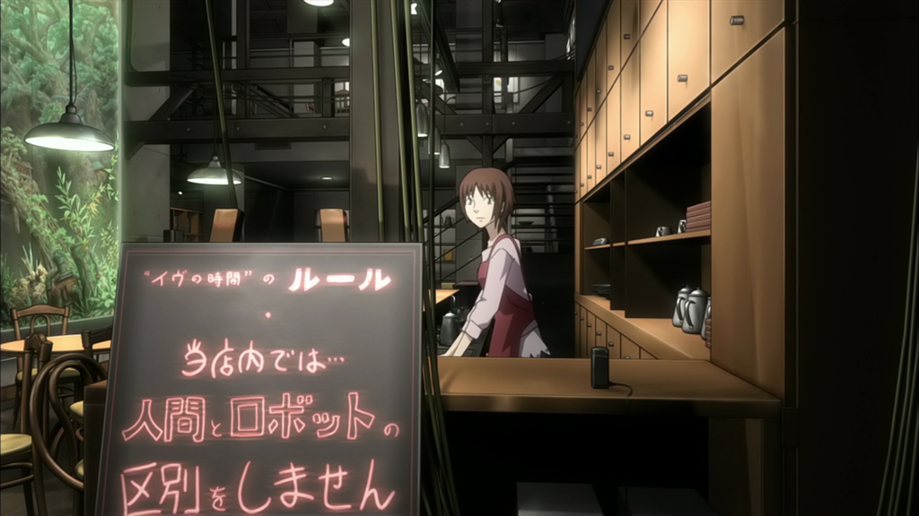 A girl in an apron stands behind the counter of a cafe with modern decor.